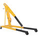 A yellow Vestil heavy-duty hydraulic telescoping crane with black legs on wheels.