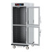A Metro C5 9 Series holding cabinet with clear glass Dutch doors.
