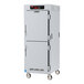 A large stainless steel Metro holding cabinet with wheels.