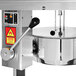 A close-up of the Cretors Mach 5 floor model popcorn popper with a round metal pot inside.