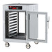 A Metro C5 8 Series holding cabinet with a clear door open.