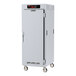 A stainless steel Metro holding cabinet with a white door and stainless steel universal slides.