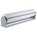 A Bulman Deluxe paper dispenser holding a white roll of paper.