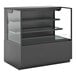 A black Structural Concepts display case with glass shelves on a counter.