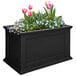 a black rectangular planter with pink and blue flowers