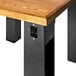 A BFM Seating black steel I-Beam table base with a black square outlet.