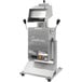 A Cretors Poppi hot air popcorn popper with a stainless steel screen.