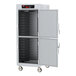 A large metal Metro holding cabinet with solid Dutch doors.