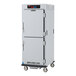 A white metal Metro C5 holding cabinet with two doors.