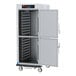 A grey Metro C5 holding cabinet with open solid Dutch doors.