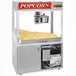 A Cretors floor model popcorn machine with a large bowl of popcorn.