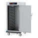 A metal cabinet with a door open holding food.