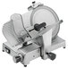 A silver Sirman Canova heavy-duty manual meat slicer with a plastic cover over the blade.