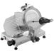 A silver Sirman manual gravity feed meat slicer.