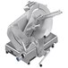 A silver Sirman manual meat slicer with a circular blade on top.