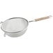 A Vollrath stainless steel mesh strainer with a wood handle.