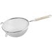 A Vollrath medium mesh wire strainer with a wooden handle.