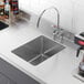 a stainless steel sink with a hole