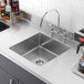 A close-up of a Regency stainless steel fabricated weld-in undermount sink bowl.