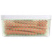 A OXO GreenSaver rectangular plastic container with carrots inside.