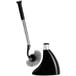 A black and silver simplehuman toilet brush in a metal stand.