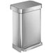 A simplehuman stainless steel rectangular step-on trash can with a lid.