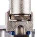 A close up of the metal gear on an Edlund Old Reliable #1 Manual Can Opener.