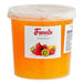 A container of Fanale Mango Popping Boba with orange liquid inside.