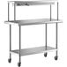 A silver stainless steel Regency expeditor table with shelves on wheels.