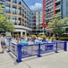 A SelectSpace royal blue square weave pattern partition panel on an outdoor patio.