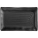 A black rectangular Acopa Izumi melamine platter with a wavy design.