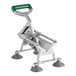 A heavy-duty vegetable dicer with a green handle and four suction cup feet for stability.