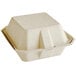 A white Tellus bagasse clamshell container with a lid.