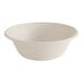 A plain, round, beige compostable fiber bowl with a wide rim.