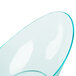 A green plastic bowl with a curved edge.