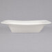 A white square porcelain plate with a wavy edge.