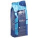 A blue bag of Lavazza Dek decaf whole bean coffee with white labeling.