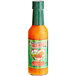 A bottle of Marie Sharp's Mild Habanero hot sauce with a green label.