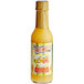 A bottle of Marie Sharp's Grapefruit Pulp Habanero Hot Sauce on a white background.