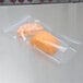 A piece of cheese in an ARY VacMaster 3 mil plastic bag.