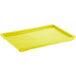 A yellow rectangular plastic tray lid.