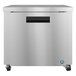 a silver refrigerator with black handle