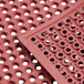 A red Choice rubber anti-fatigue floor mat with holes.