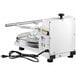 A white machine with a black cord and a black handle.