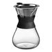 An Acopa glass coffee maker with a black silicone collar.