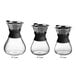 An Acopa glass pour over drip pot with a black rubber band.