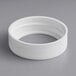 A white plastic ring with a threaded ring on it.