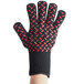 a black glove with red dots on it