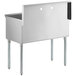 a stainless steel sink with legs