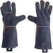 A pair of black leather gloves with orange trim and stitching.